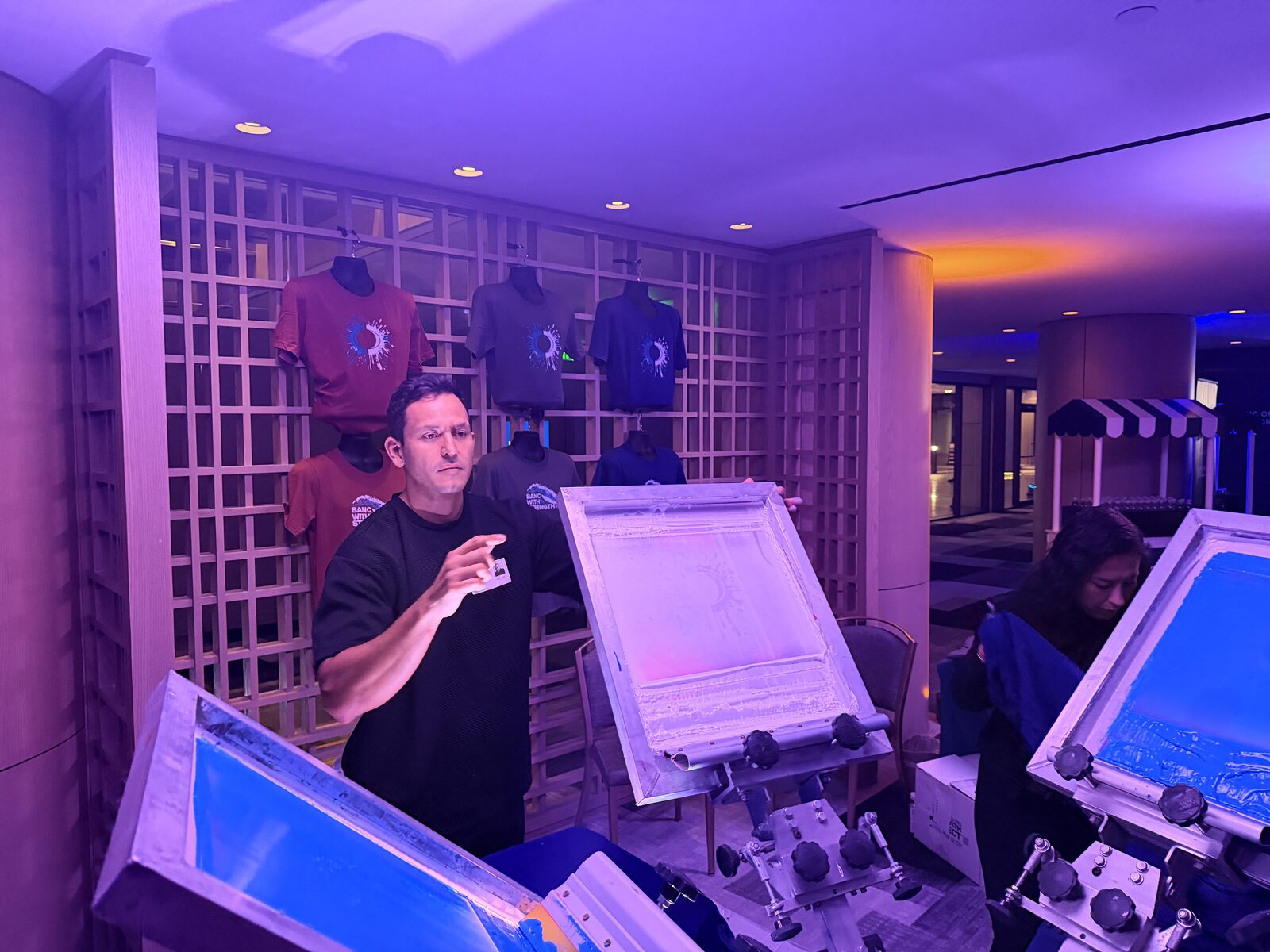 Presses glowing at a night festival activation